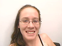 Nerdy girl in glasses gives a blowjob in an office